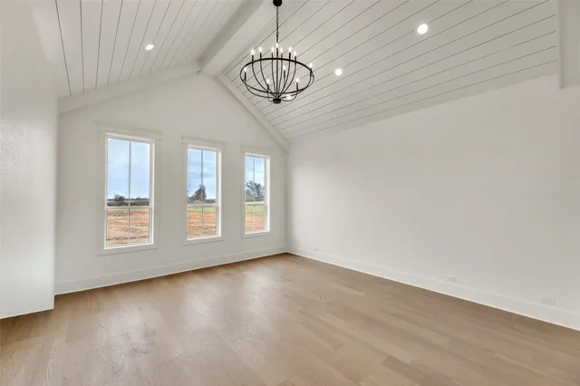 a view of livingroom with window hardwood floor and a ceiling fan