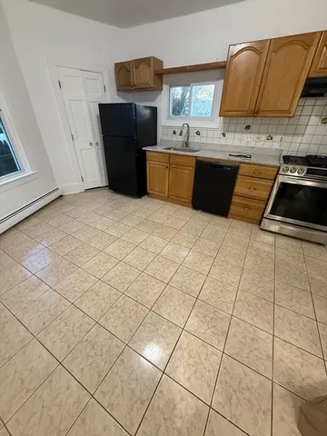 a kitchen with stainless steel appliances a sink and a counter top