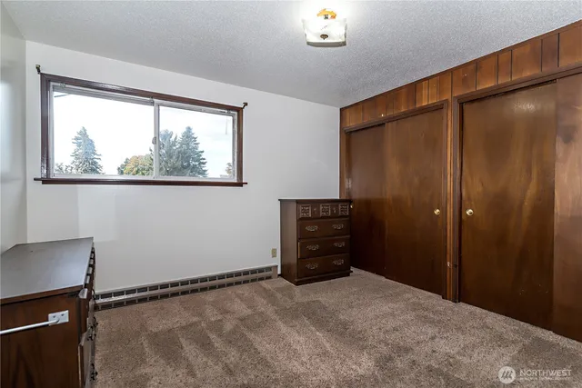 a view of room with window and furniture