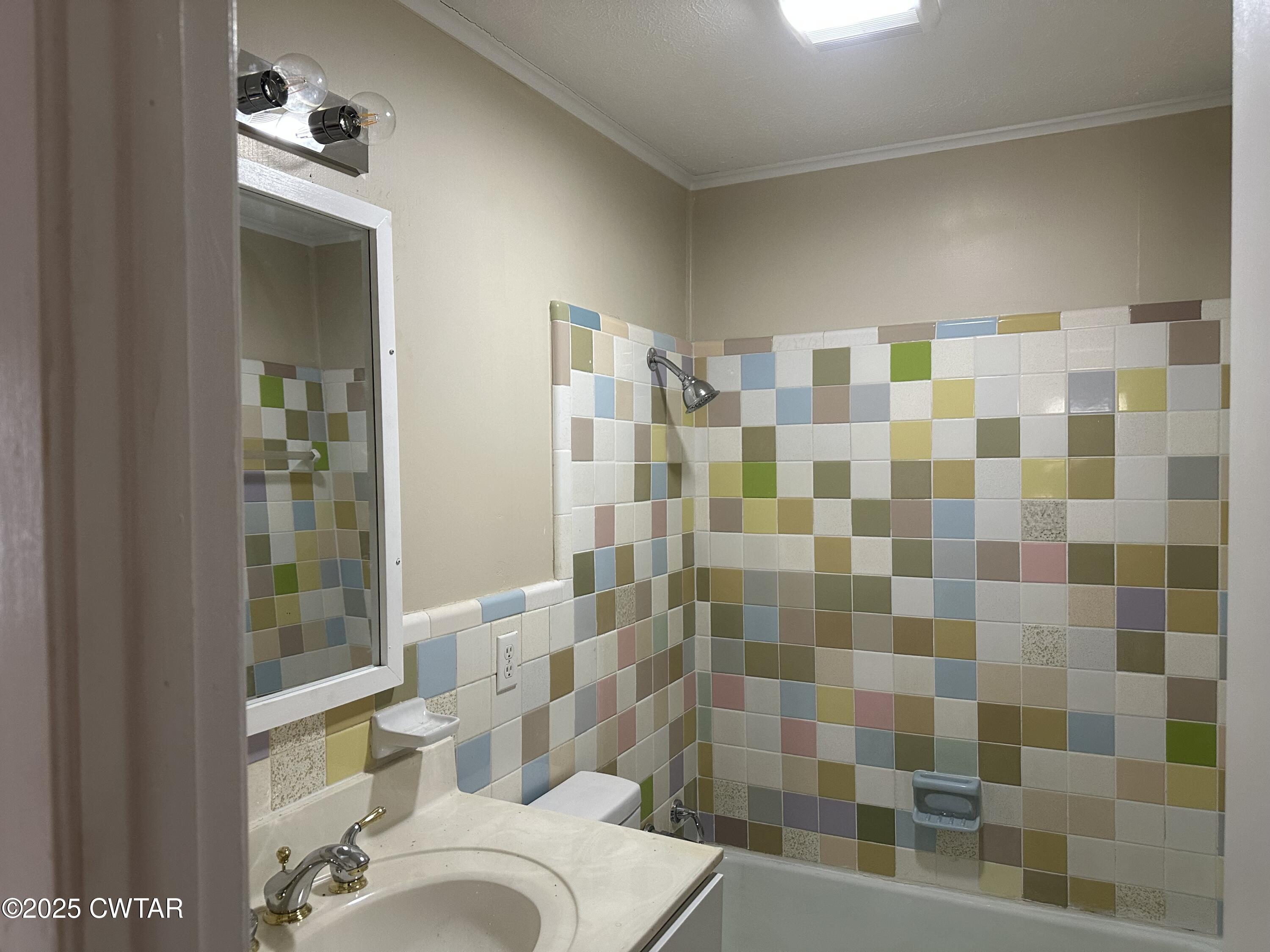 2400 Peddy Vestal Loop Henderson, TN 38340 - Photo 24 of 40 a bathroom with a sink toilet and shower