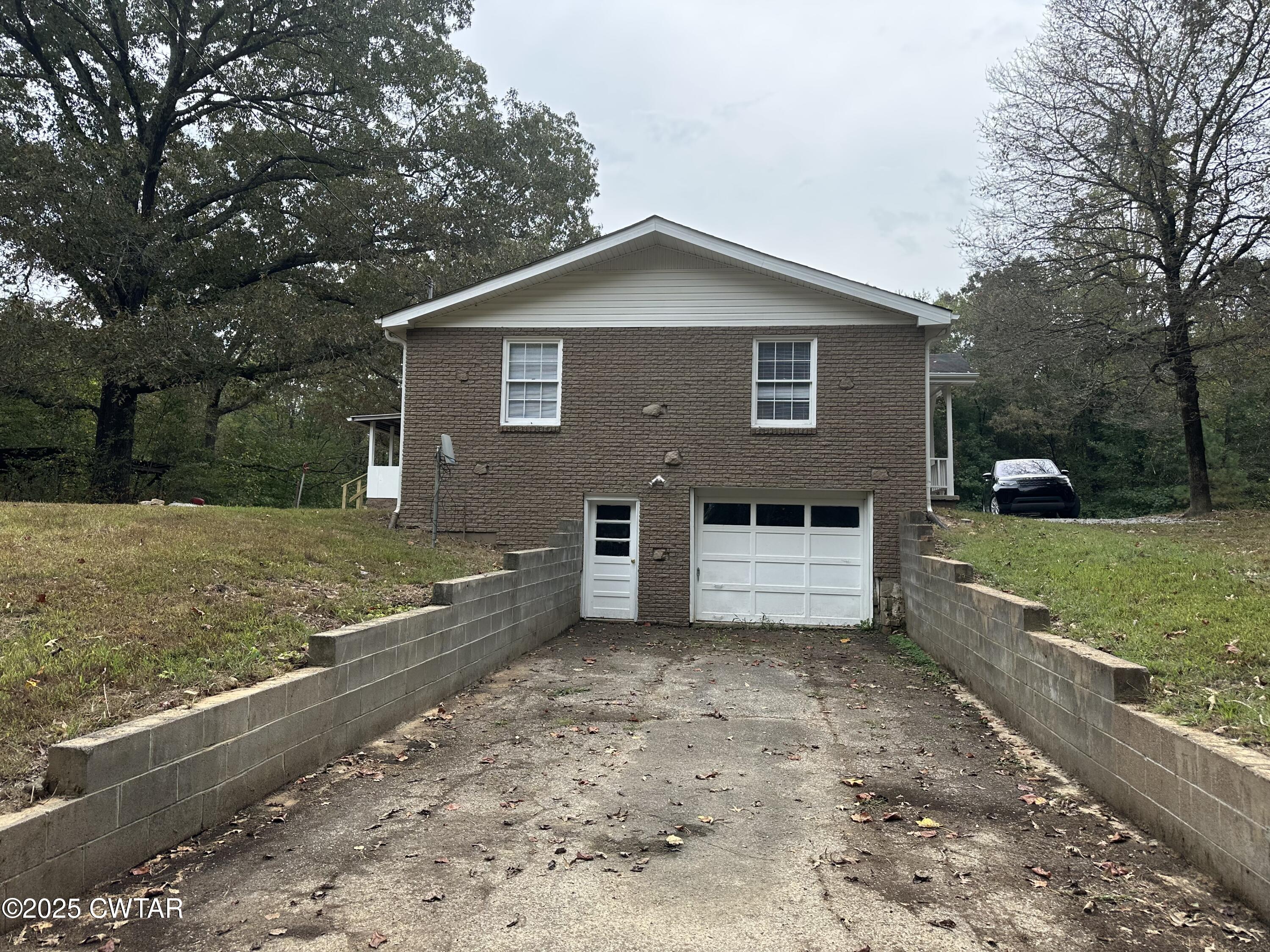2400 Peddy Vestal Loop Henderson, TN 38340 - Photo 29 of 40 a view of a house with a yard