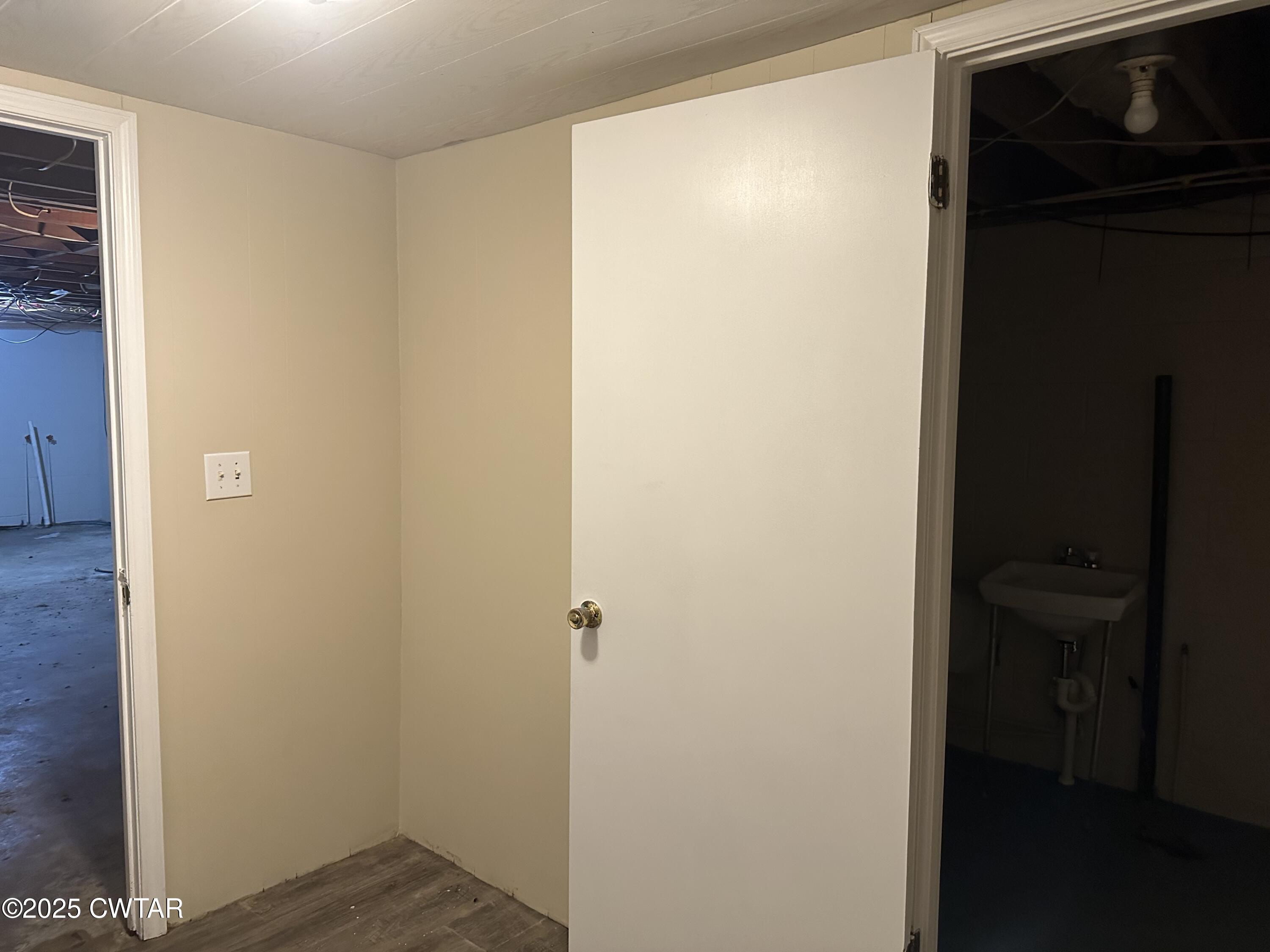 2400 Peddy Vestal Loop Henderson, TN 38340 - Photo 30 of 40 a view of a hallway with wooden floor