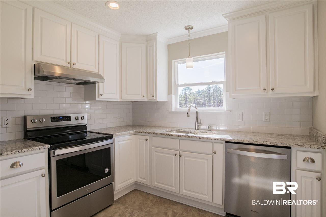 9141 Semmes Court Semmes, AL 36575 - Photo 11 of 28 Whirlpool stainless appliances.