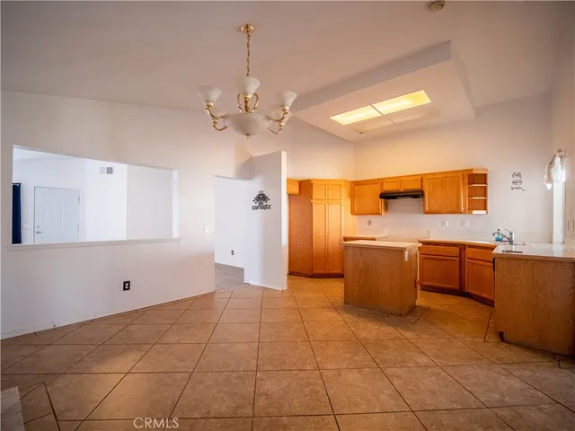 a view of a kitchen with a sink and dishwasher