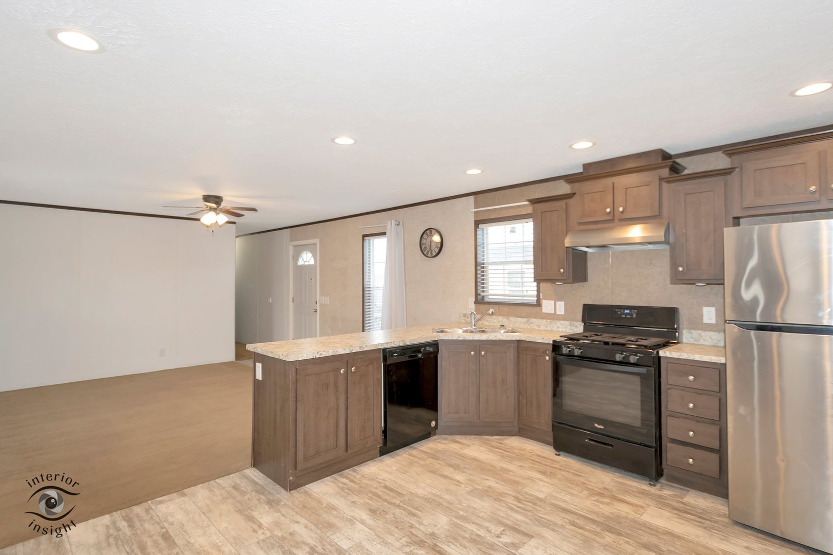 37 St George Bourbonnais, IL 60914 - Photo 11 of 27 a kitchen with stainless steel appliances granite countertop a refrigerator a sink dishwasher a stove with white cabinets and wooden floor