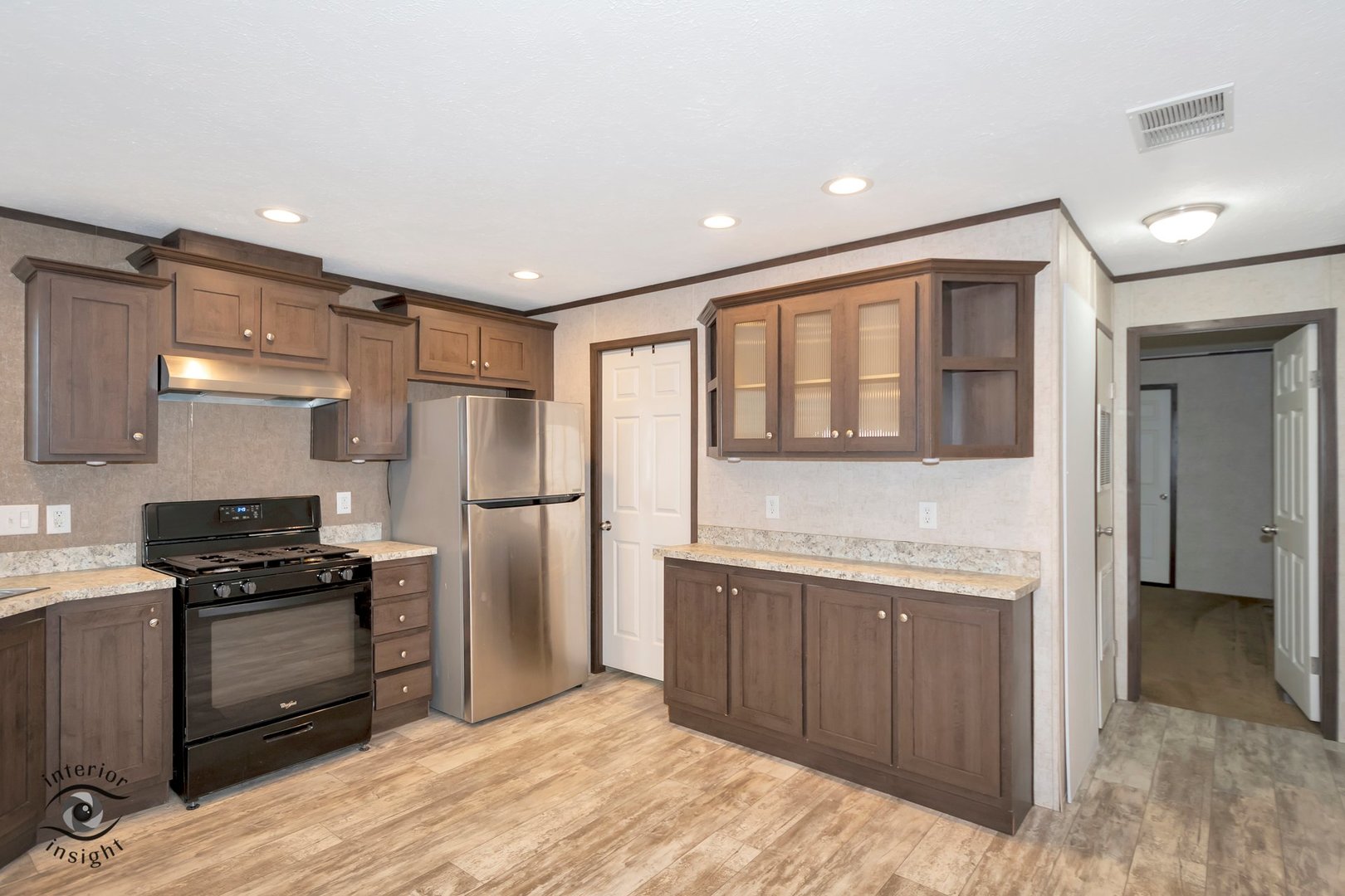 37 St George Bourbonnais, IL 60914 - Photo 10 of 27 a kitchen with a refrigerator and a sink