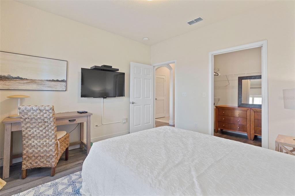 1216 South Missouri Avenue, Unit 419 Clearwater, FL 33756 - Photo 15 of 22 a bedroom with a bed and a television