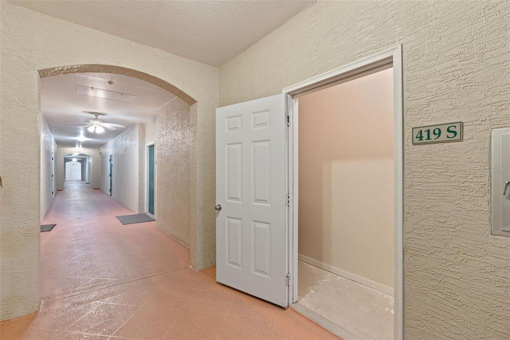 1216 South Missouri Avenue, Unit 419 Clearwater, FL 33756 - Photo 19 of 22 a view of a hallway with wooden floor