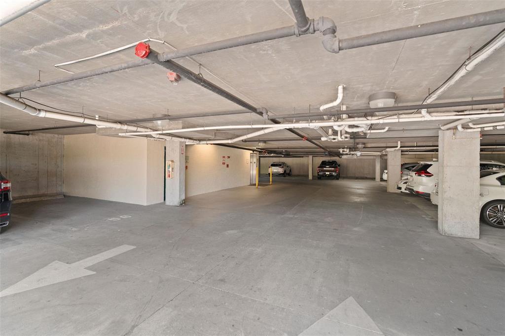 1216 South Missouri Avenue, Unit 419 Clearwater, FL 33756 - Photo 22 of 22 a view of parking garage with cars and other equipment
