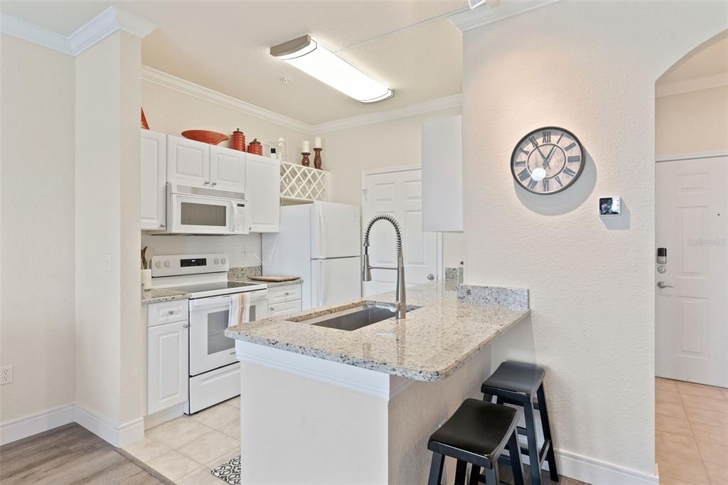1216 South Missouri Avenue, Unit 419 Clearwater, FL 33756 - Photo 9 of 22 a very nice looking kitchen with cabinets