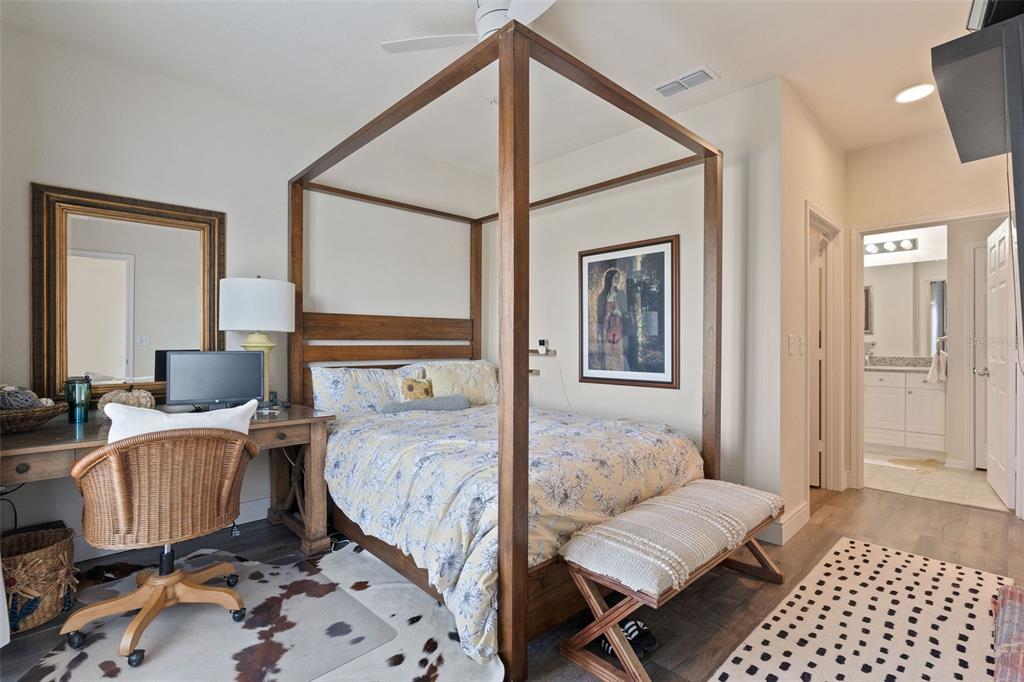 1216 South Missouri Avenue, Unit 419 Clearwater, FL 33756 - Photo 10 of 22 a bedroom with a bed and wooden floor