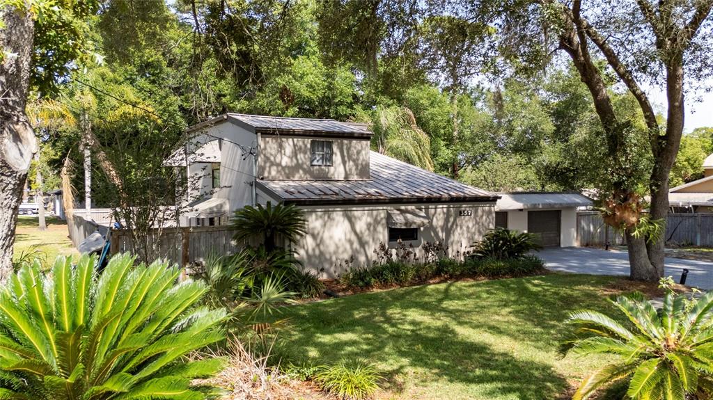 357 Ridgewood Street Altamonte Springs, FL 32701 - Photo 3 of 36 a front view of a house with a yard