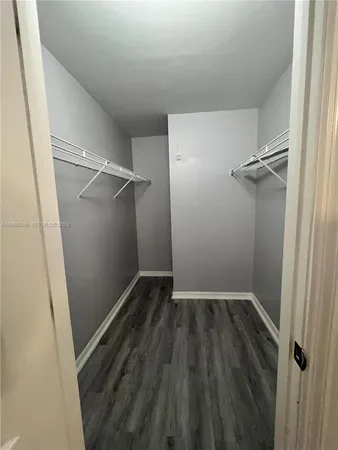 a bathroom with a double vanity sink toilet and shower
