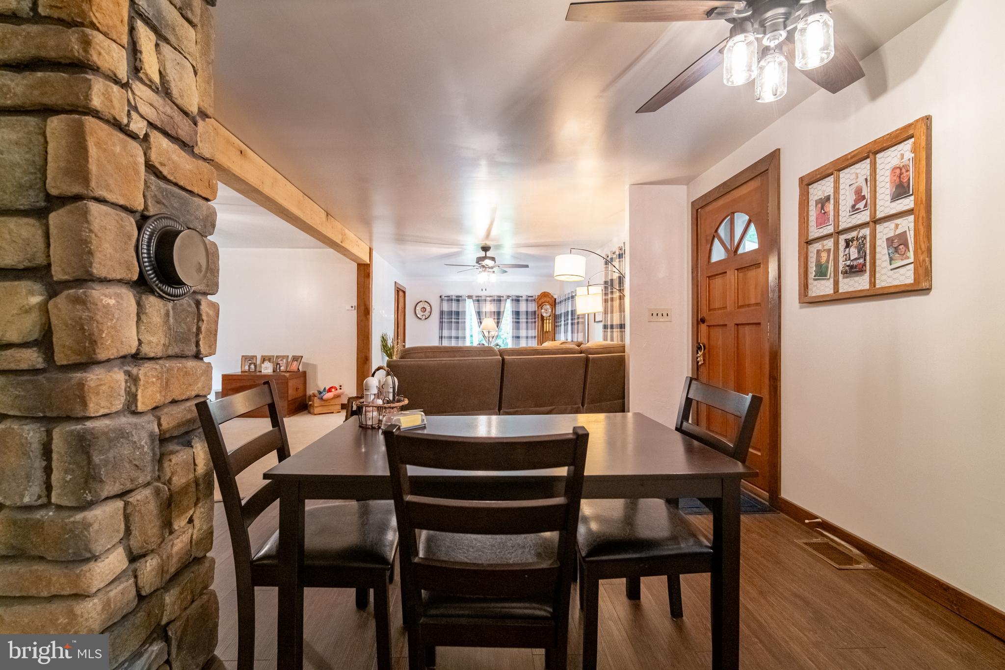 13127 Manor Furnace Road Brogue, PA 17309 - Photo 34 of 78 a view of a dining room with furniture and wooden floor