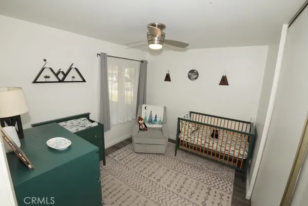a view of a hardwood floor and dining room