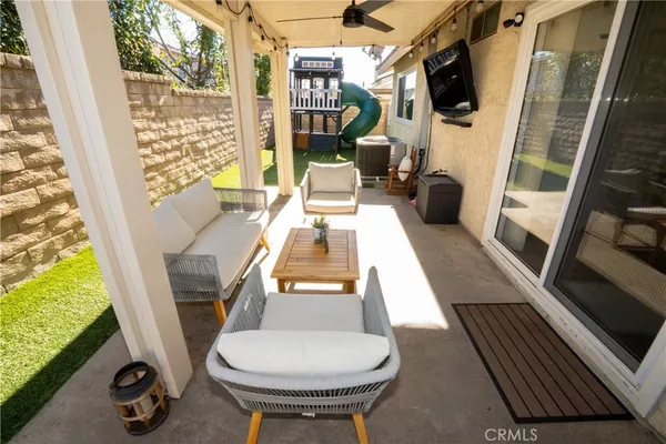 a view of living room with furniture and flat screen tv