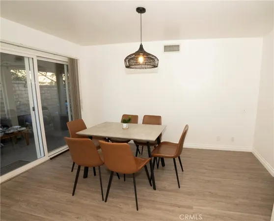 a dining room with a table and chairs