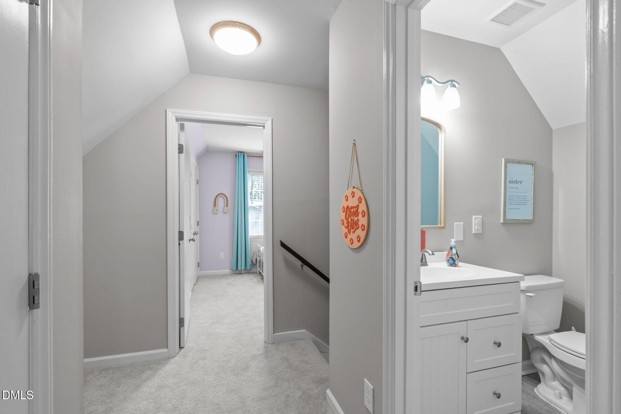 717 Habersham Place Raleigh, NC 27610 - Photo 21 of 59 a bathroom with a toilet sink and mirror