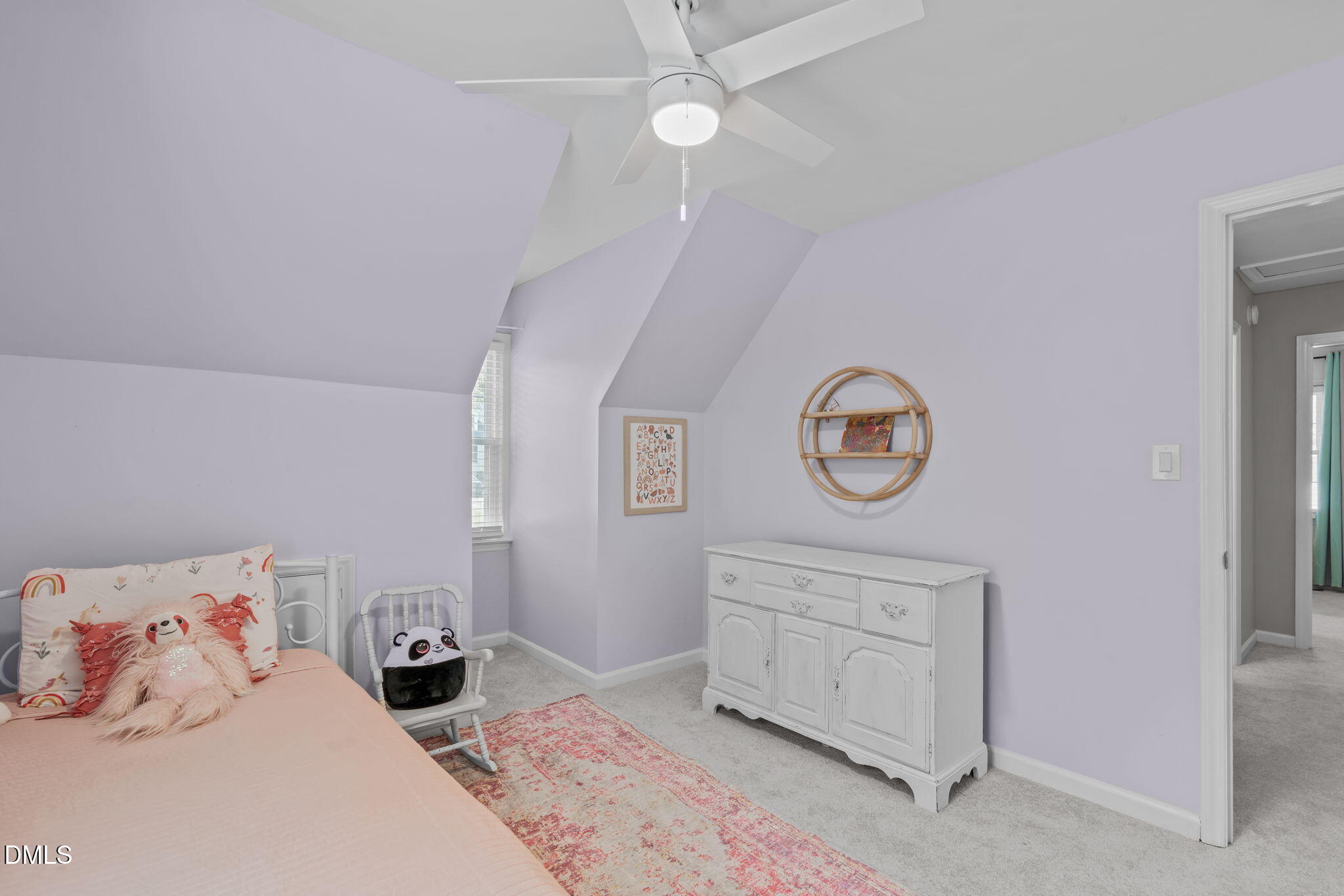 717 Habersham Place Raleigh, NC 27610 - Photo 23 of 59 a bedroom with a bed a chandelier and a dresser