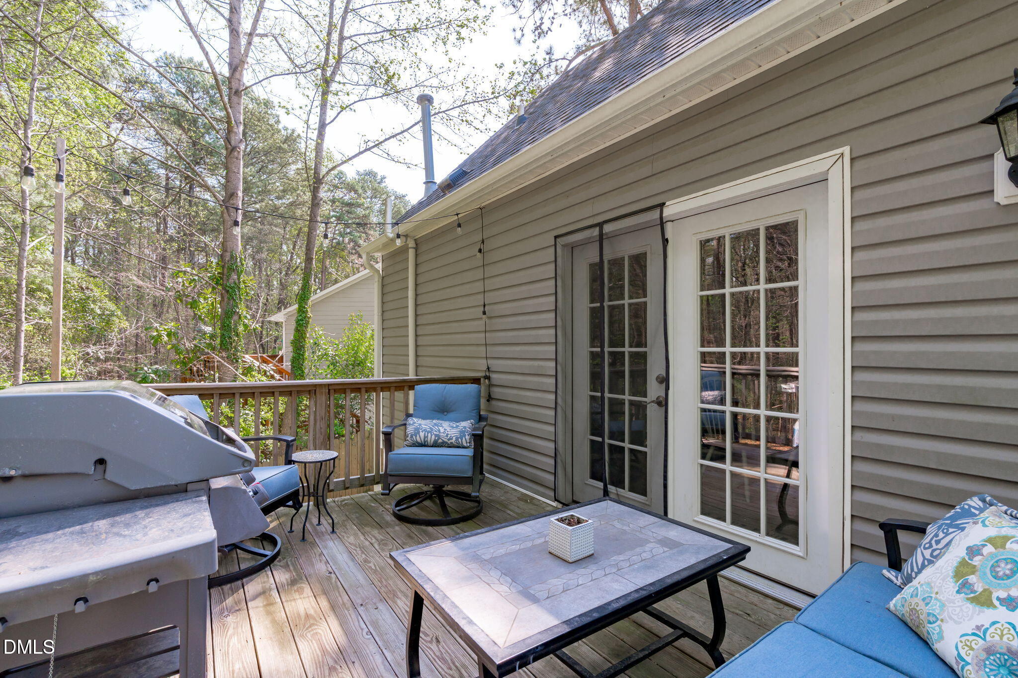 717 Habersham Place Raleigh, NC 27610 - Photo 37 of 59 a view of a patio with couple of chairs and a fire pit