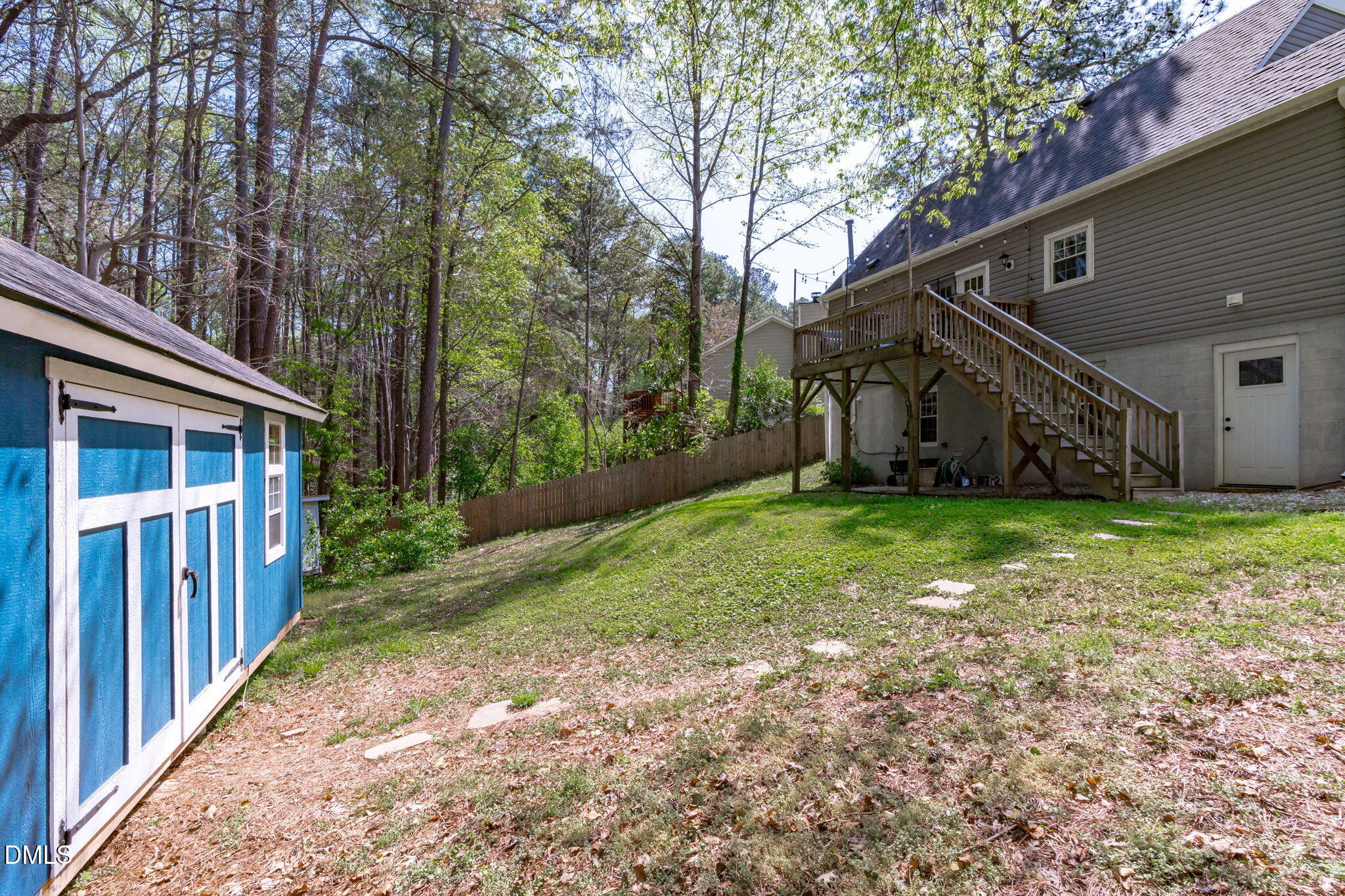 717 Habersham Place Raleigh, NC 27610 - Photo 41 of 59 a backyard of a house with lots of green space