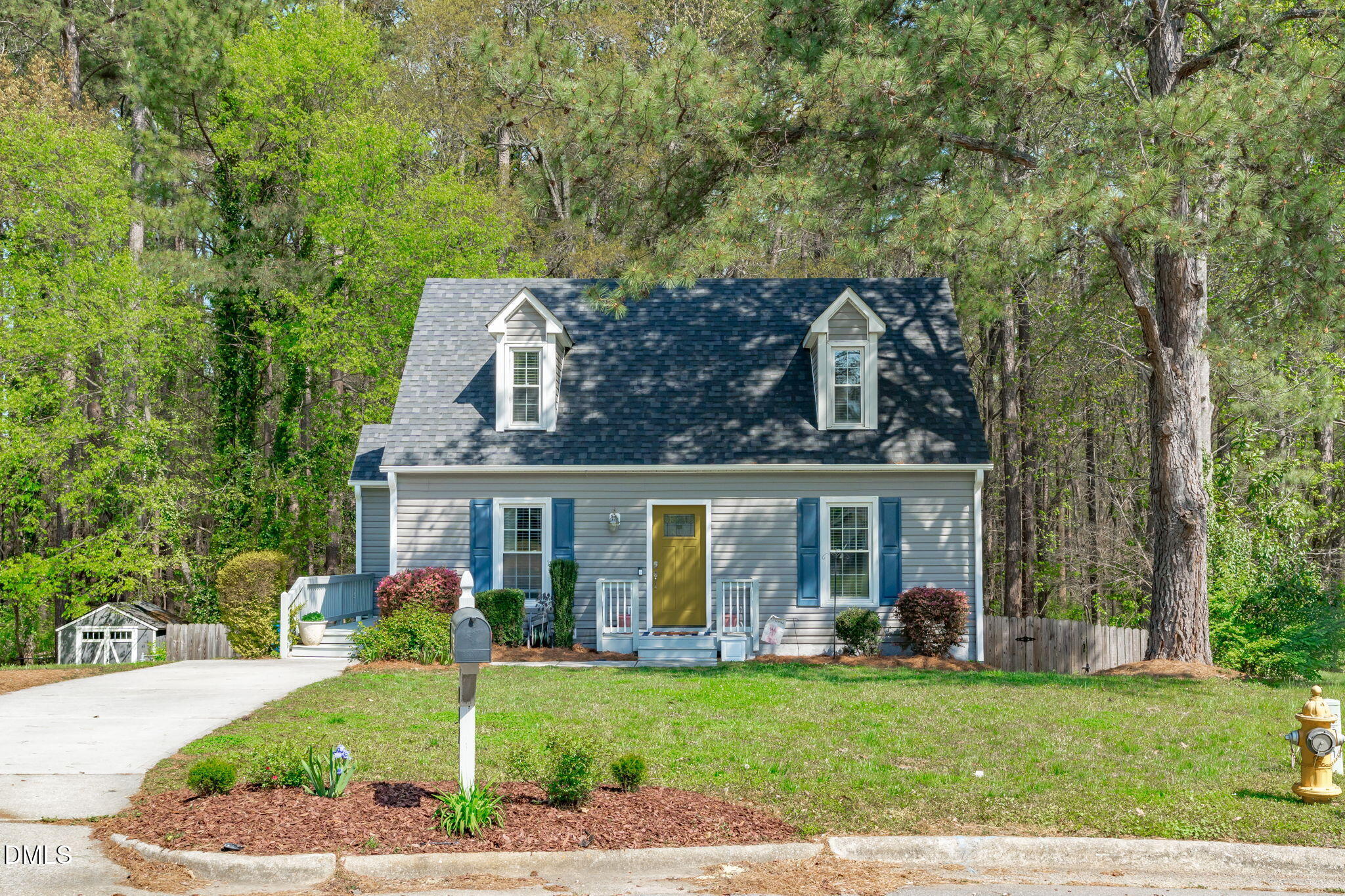 717 Habersham Place Raleigh, NC 27610 - Photo 46 of 59 front view of a house with a garden
