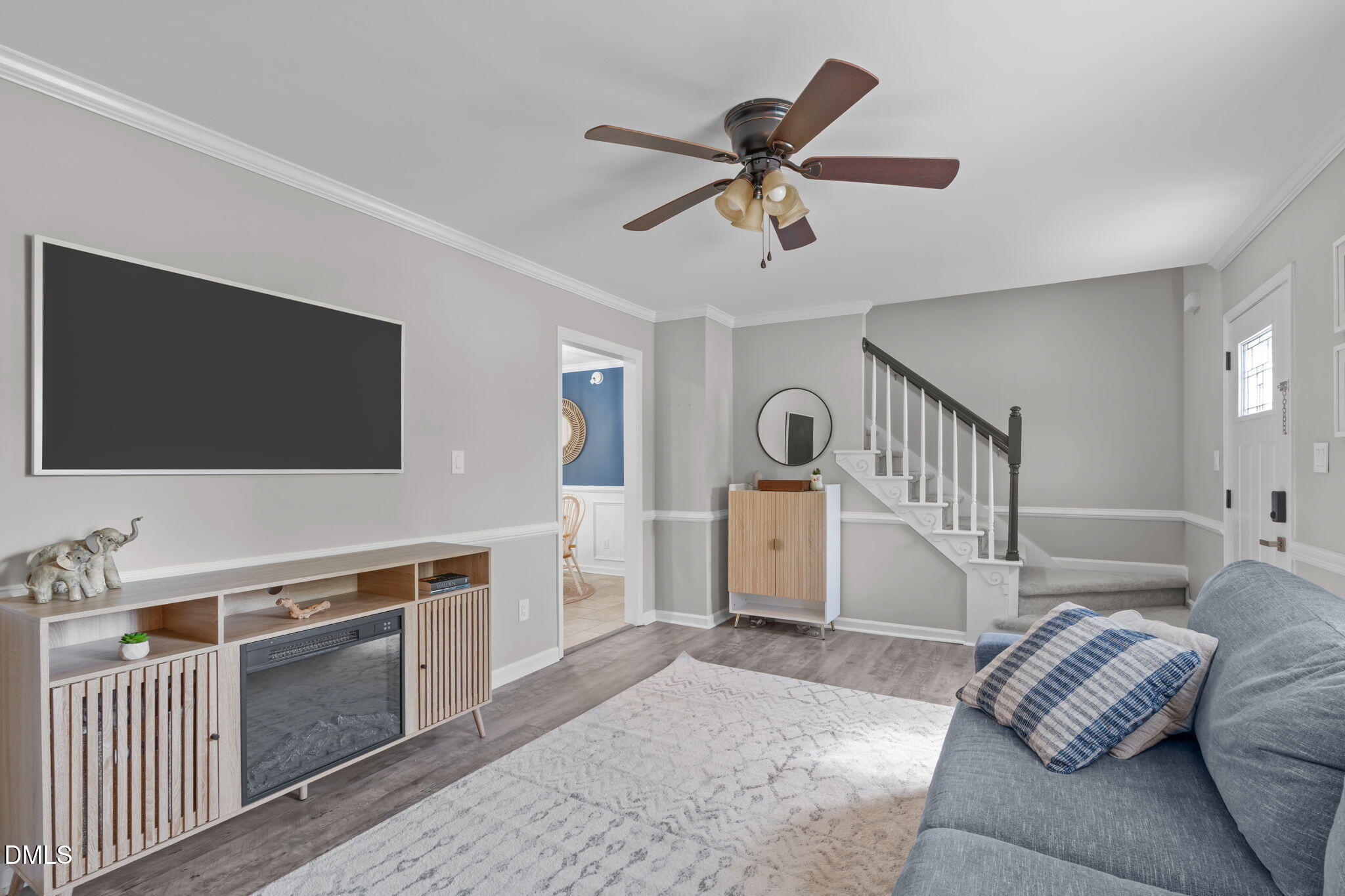 717 Habersham Place Raleigh, NC 27610 - Photo 5 of 59 a living room with furniture and a flat screen tv