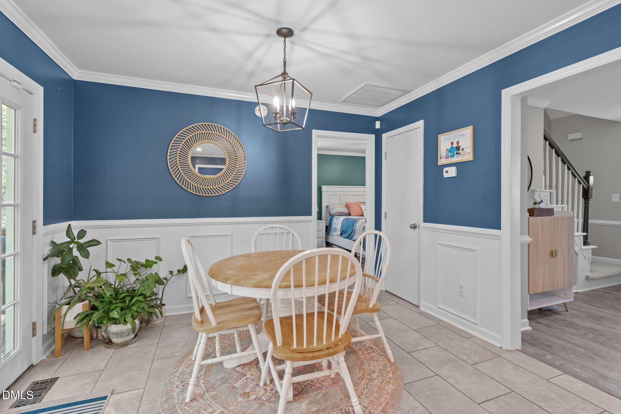 717 Habersham Place Raleigh, NC 27610 - Photo 9 of 59 a view of a dining room with furniture and chandelier