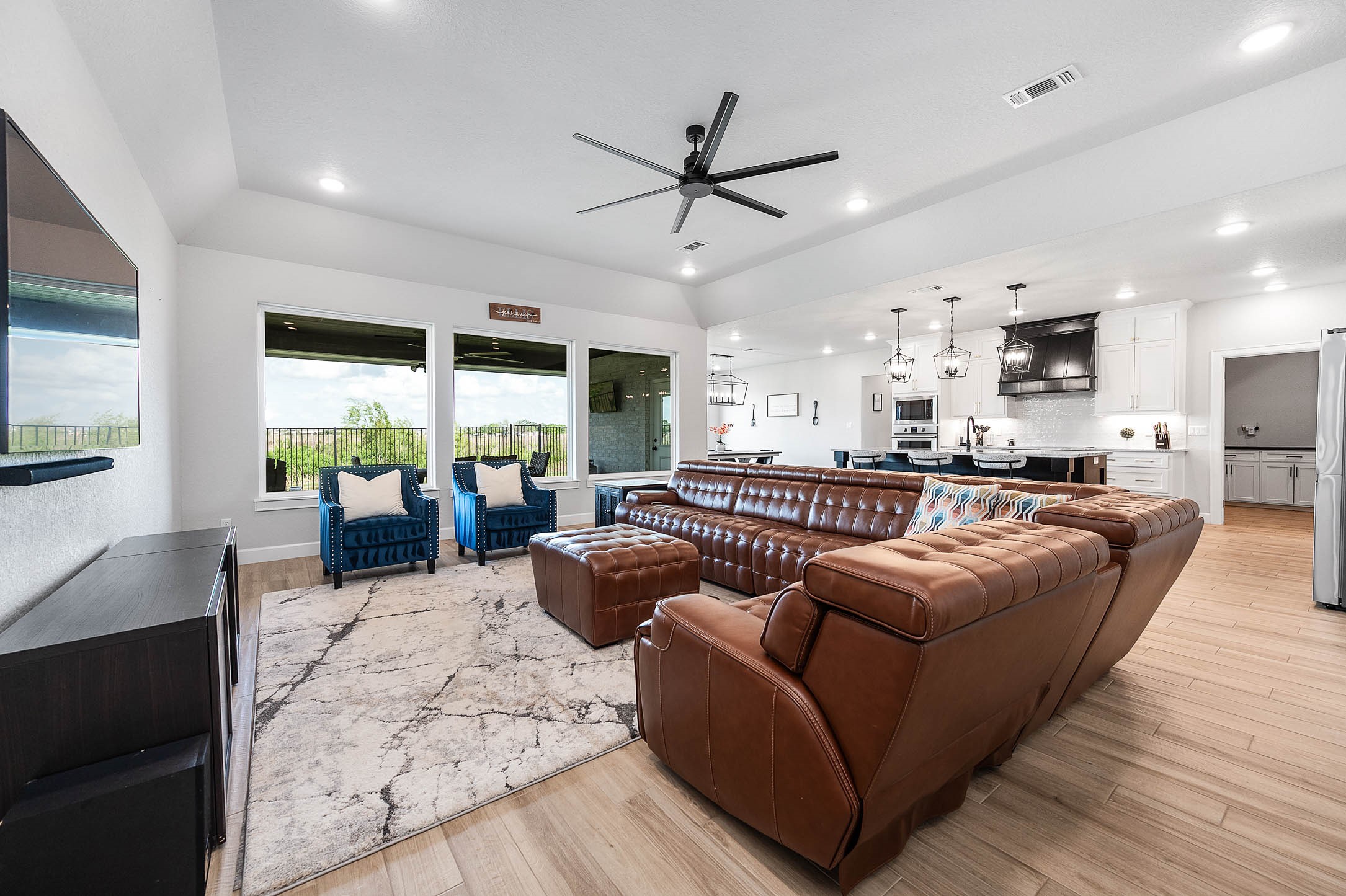 800 Greystone Lane Angleton, TX 77515 - Photo 11 of 49 a living room with furniture and a large window