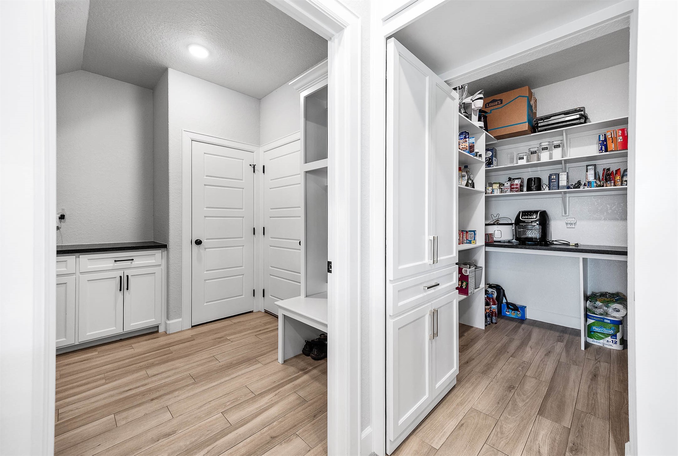 800 Greystone Lane Angleton, TX 77515 - Photo 21 of 49 a kitchen with cabinets and wooden floor