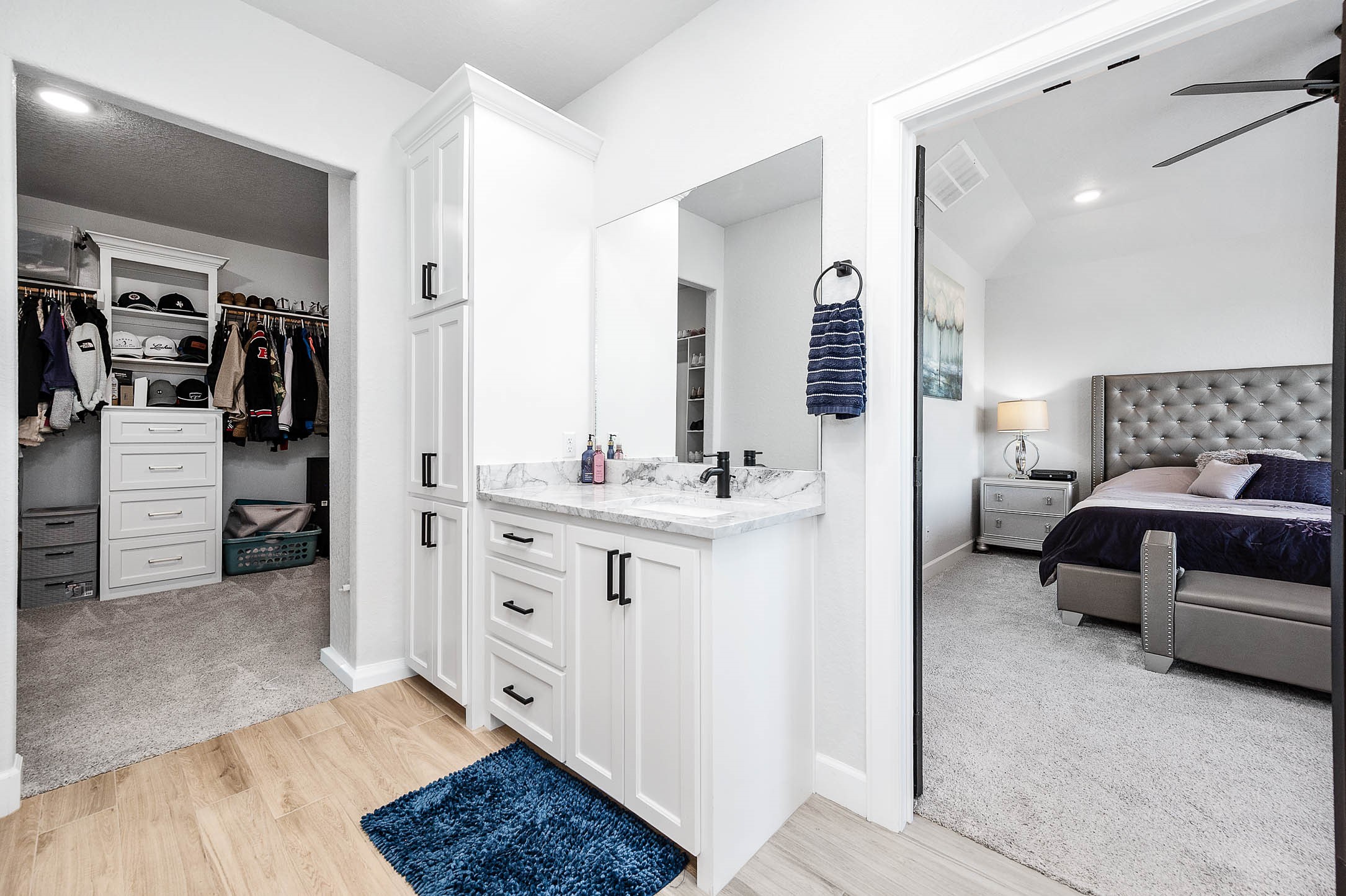800 Greystone Lane Angleton, TX 77515 - Photo 25 of 49 a en suite bathroom with a double vanity sink and mirror