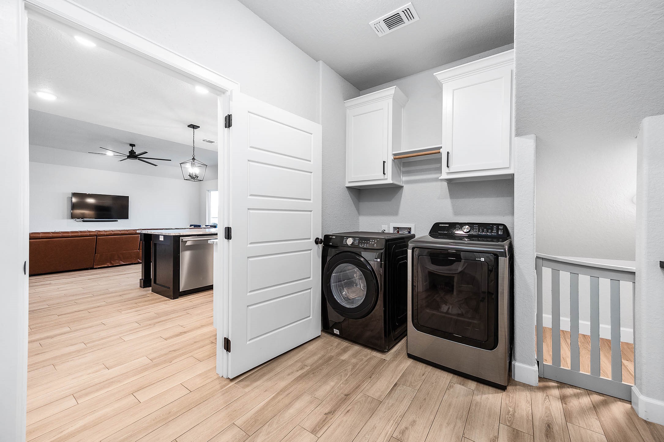 800 Greystone Lane Angleton, TX 77515 - Photo 29 of 49 a kitchen with stainless steel appliances kitchen island wooden cabinets and granite counter tops