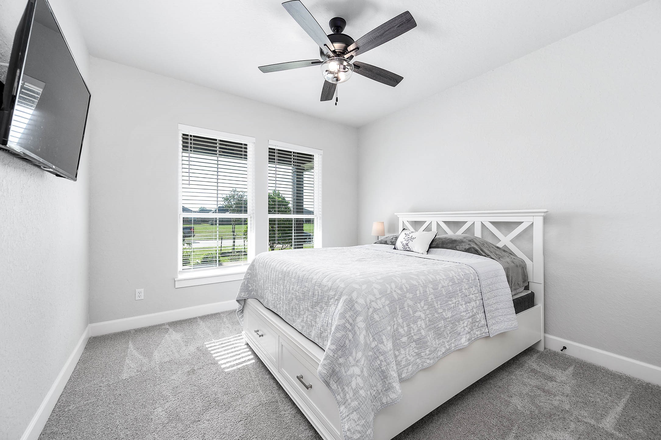 800 Greystone Lane Angleton, TX 77515 - Photo 31 of 49 a large bed sitting in a bedroom next to a window