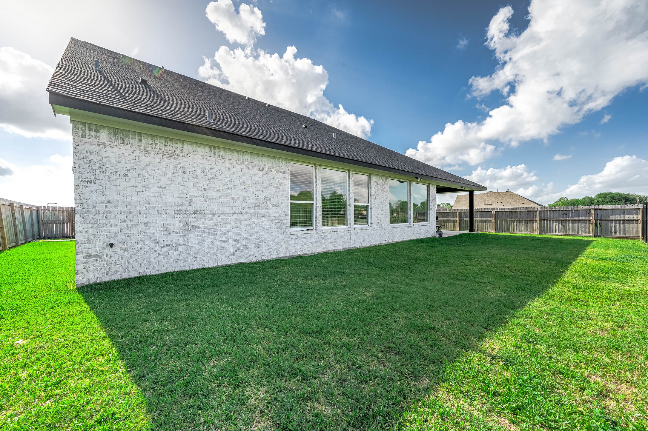800 Greystone Lane Angleton, TX 77515 - Photo 42 of 49 a view of a house with a backyard