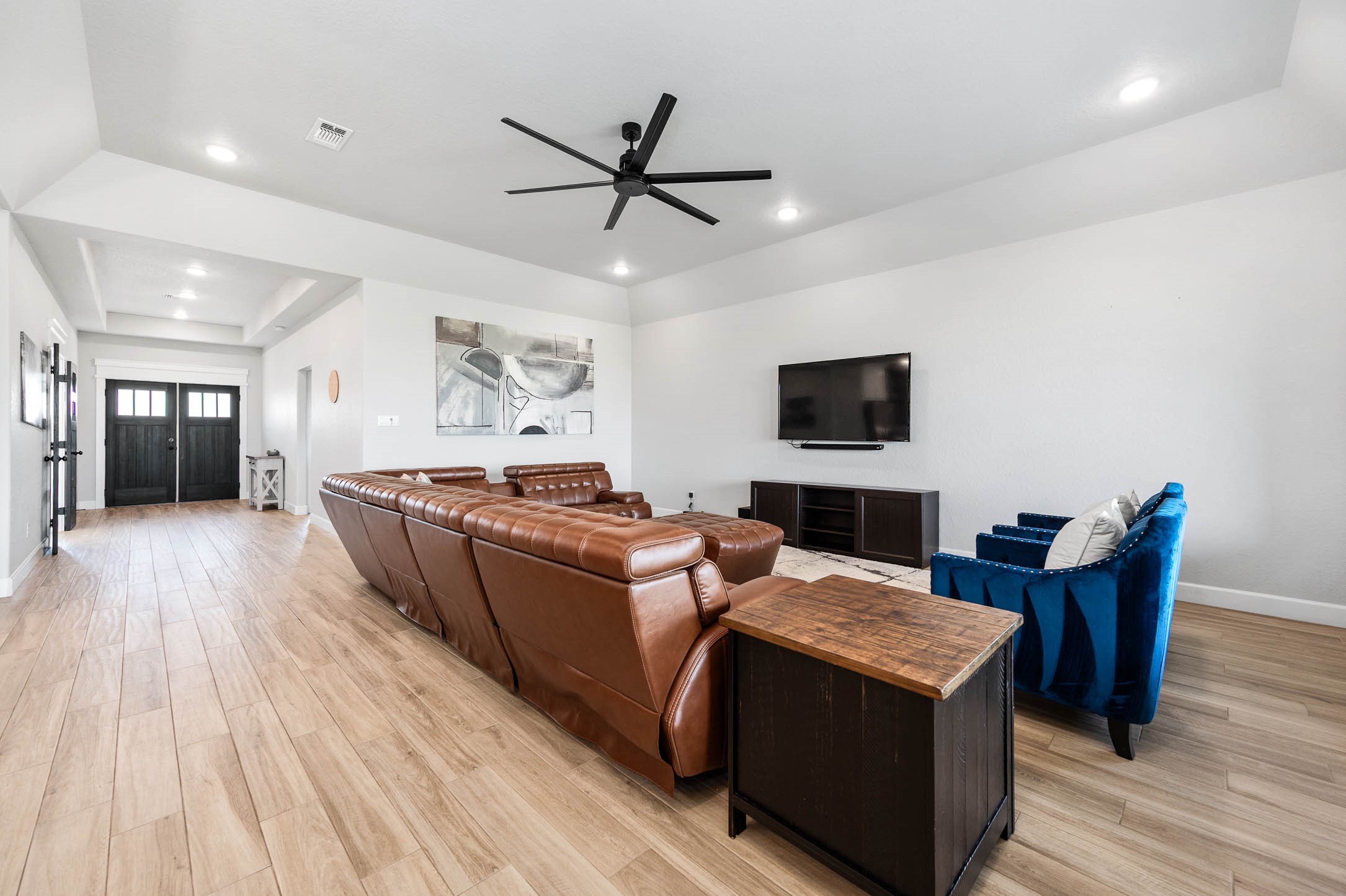 800 Greystone Lane Angleton, TX 77515 - Photo 8 of 49 a living room with furniture and a flat screen tv