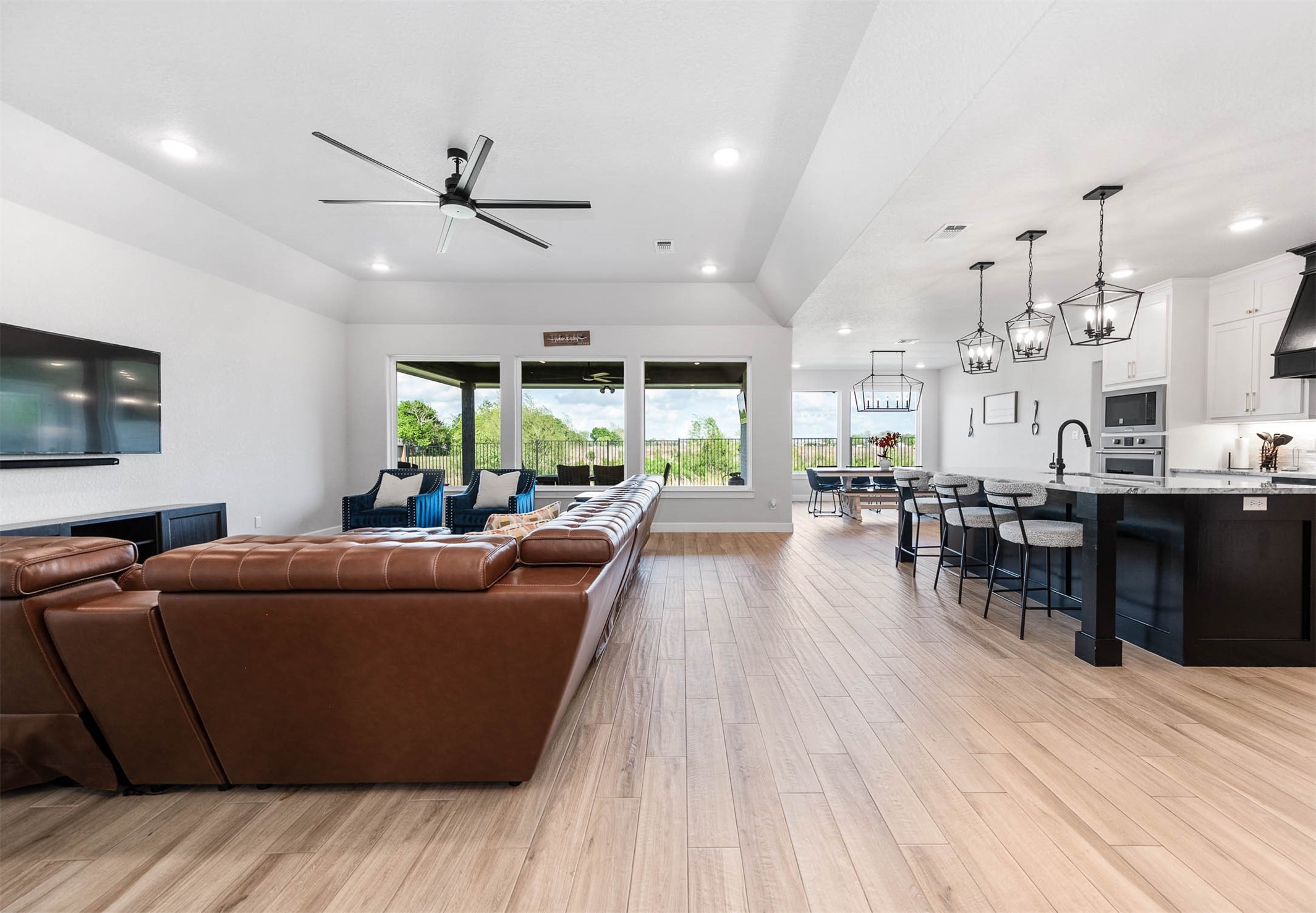 800 Greystone Lane Angleton, TX 77515 - Photo 9 of 49 a living room with furniture and a wooden floor