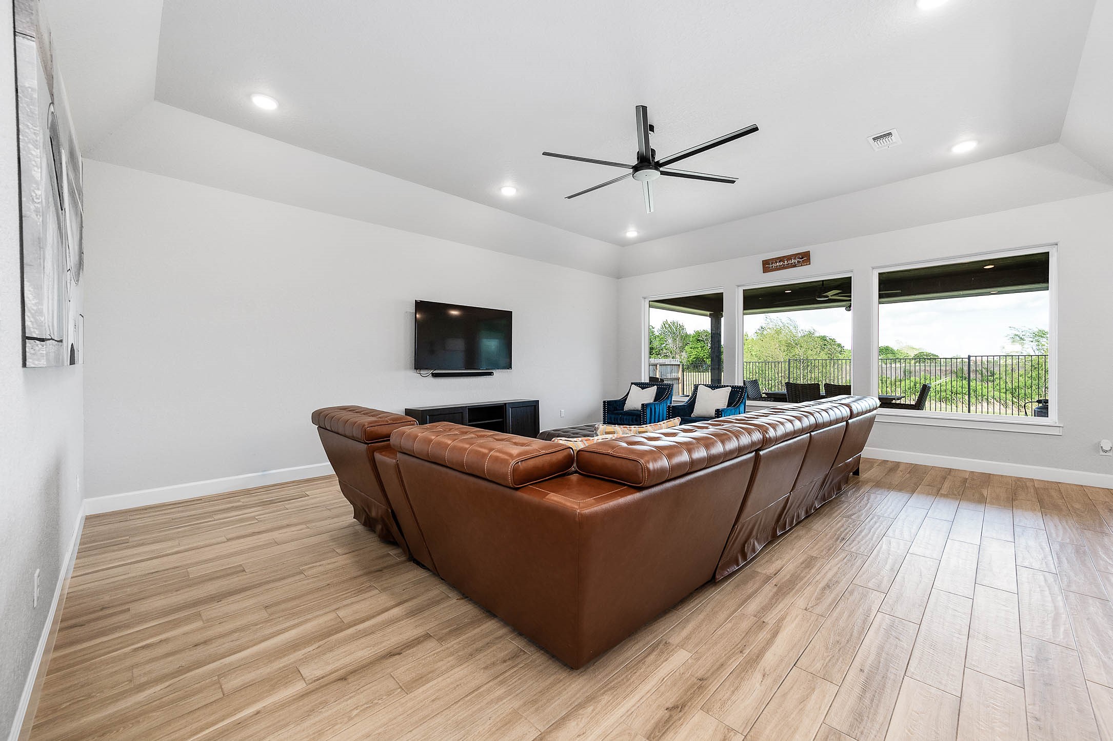 800 Greystone Lane Angleton, TX 77515 - Photo 10 of 49 a living room with furniture and a large window