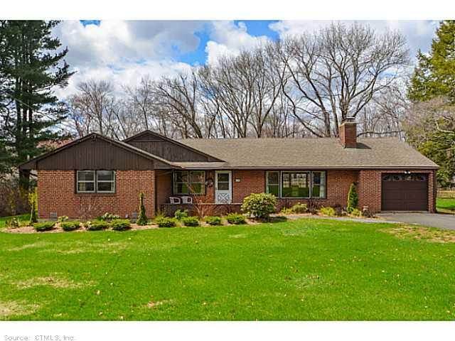 197 Duncaster Road Bloomfield, CT 06002 - Photo 1 of 1 a front view of a house with a yard and trees