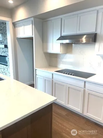 a kitchen with stainless steel appliances a sink a stove and a refrigerator