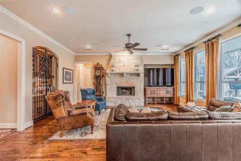 a living room with furniture ceiling fan and a rug