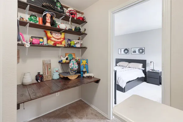 a bedroom with a bed and dresser