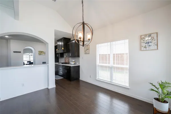 a view of a living room with wooden floor