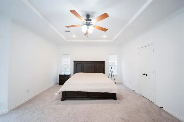 a bedroom with a bed and window