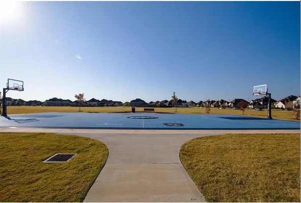 a view of a swimming pool and an outdoor seating