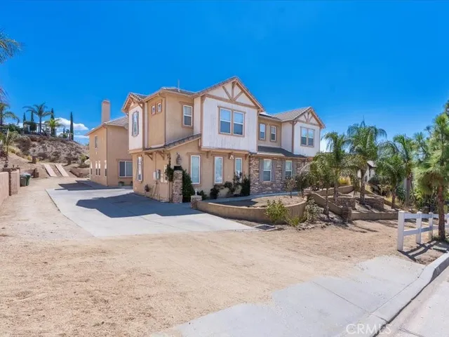 a front view of a house with sitting area
