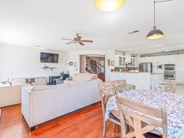 a living room with fireplace furniture and a wooden floor