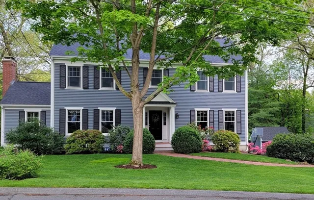 front view of a house next to a yard