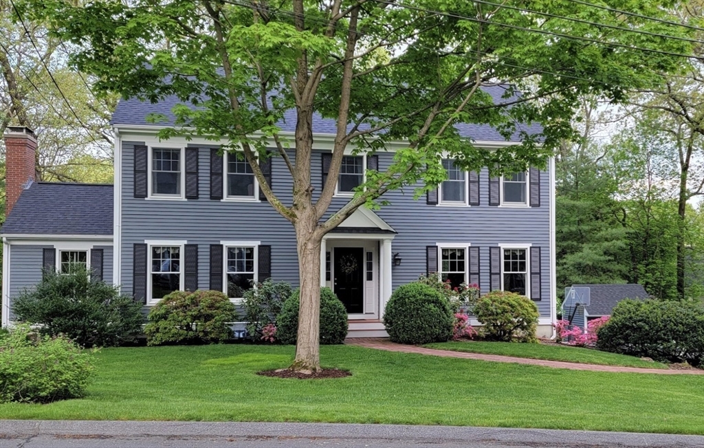 front view of a house next to a yard