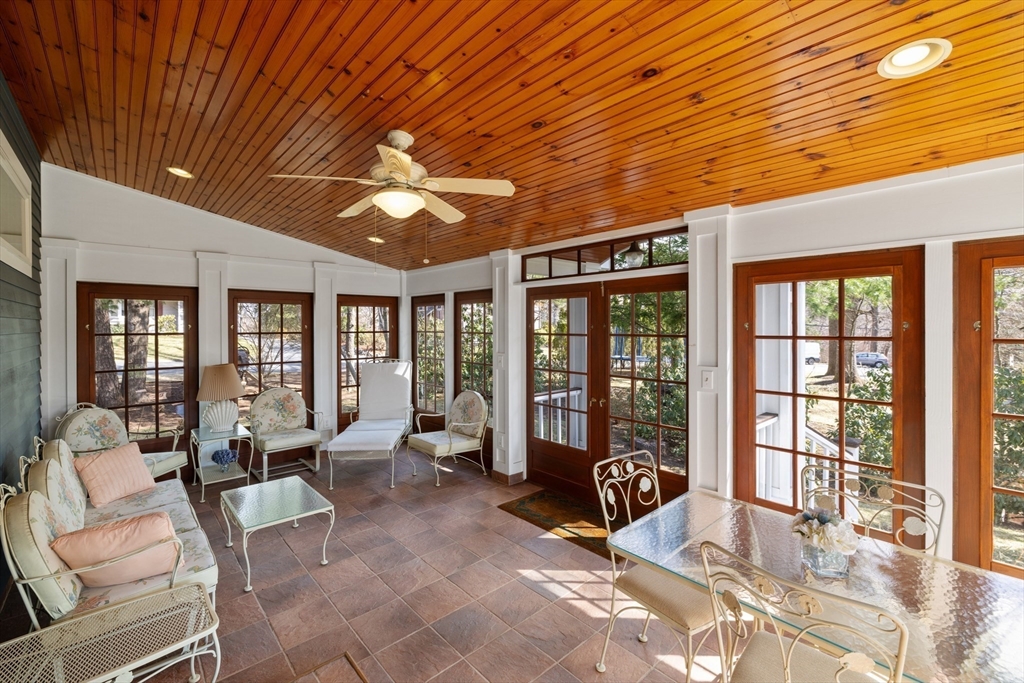 2 Marlboro Road Lexington, MA 02421 - Photo 18 of 36 a living room with furniture large windows and flat screen tv