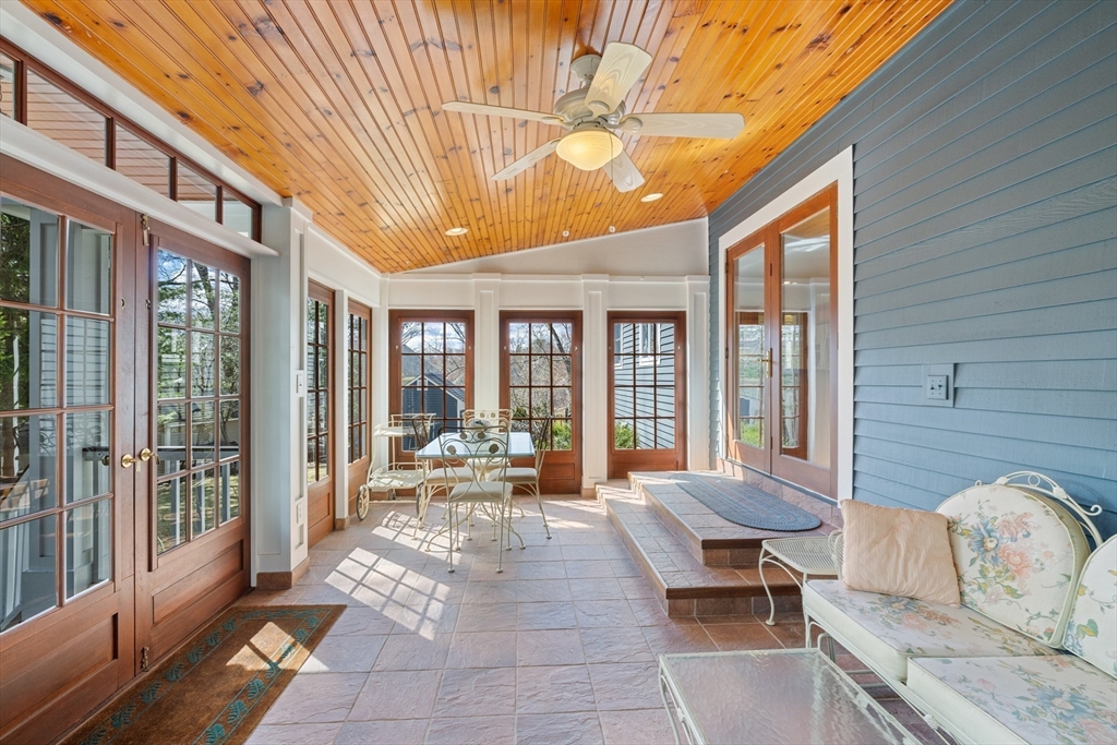 2 Marlboro Road Lexington, MA 02421 - Photo 20 of 36 a view of a patio with couches table and chairs and potted plants